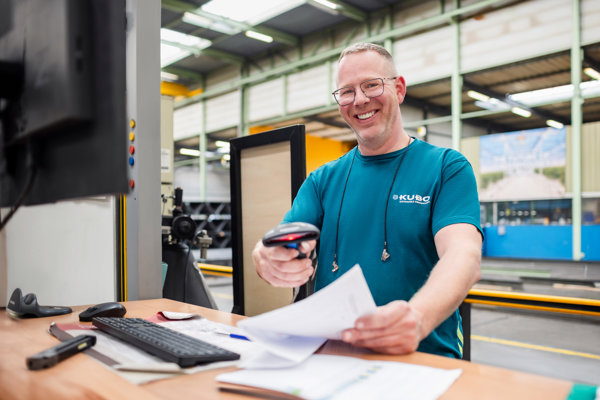 Smiling man scanning packing list